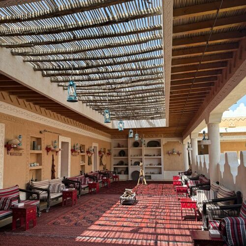 env: Traditional terrace seating with carpets